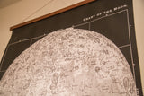 Intricate craters and labels on the detailed white lunar surface of the moon chart.