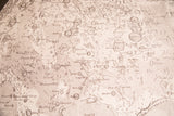 Intricate black and white detailing of identified lunar segments on the chart.