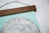 Mint canvas pull down chart with walnut wood rod, showing 'CHART OF THE MOON' title.