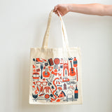 Two-color screen-printed Portland icons in orange and blue on a natural canvas tote bag.