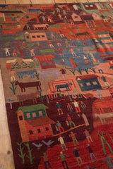 Plush hand-knotted Tibetan folk art rug with natural-dyed pictorial village scenes.