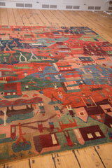 Detailed corner of the Tibetan folk art carpet, showcasing colorful village figures and animals.
