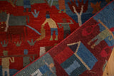 Plush Tibetan rug featuring indigo blue and madder red folk art pictorial scenes.