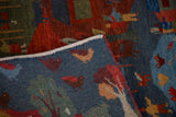 Folded New Tibetan Folk Art rug runner with pictorial birds, trees, and its white cotton foundation.