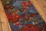 Plush pile Tibetan folk art rug displaying vibrant pictorial village and herding scenes.