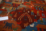 Hand-knotted Tibetan folk art rug close-up, showing pictorial village scenes and animals.
