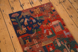 Hand-knotted Tibetan folk art runner detail, depicting houses, people, and trees.