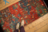 Hand-knotted Tibetan folk art runner with vivid madder red and indigo blue motifs.