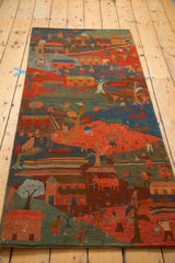 Hand-knotted Tibetan folk art runner: vibrant village scene in madder red and indigo.