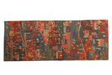 Hand knotted Tibetan Folk Art rug runner with abstract red, blue, green design, 2'7