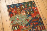 Vibrant pictorial scene on hand-knotted Tibetan folk art rug in indigo and madder red.