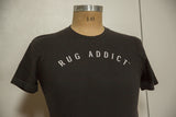 Men's charcoal fine crew t-shirt with the 'Rug Addict' graphic in an arc.