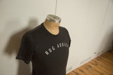 Charcoal Rug Addict t-shirt with contrast stitching viewed from an angle on a mannequin.