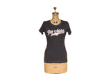Women's charcoal t-shirt with a retro 'Rug Addict' graphic, scoop neck, and contrast stitching.