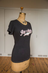 Form-fitting charcoal women's t-shirt showing hem and contrast stitching.