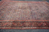 Collector antique Persian Fereghan rug, detailing its madder red border and green-teal field.
