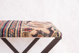 Antique Persian Khorassan Doroksh rug fragment, detailed aged beige field with intricate red and blue motifs.