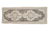 Vintage Oushak runner rug with faded brown and beige cloud-like medallions, circa 1950s, 2'10