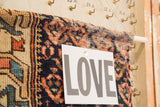 Fine hand-knotted antique Northwest Persian rug fragment with 'LOVE' card on RUGLING.