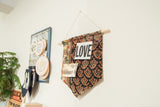 Antique Northwest Persian rug fragment cork board flag with dark and orange geometric motifs.