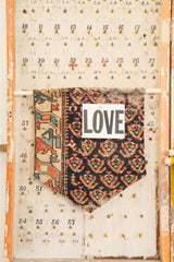 Antique Northwest Persian rug fragment flag, dark blue field, geometric patterns, 'LOVE' note.