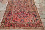 Antique Persian rug corner displays shabby tribal Herati design and unique scrolling border.