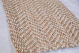 Sadie natural jute carpet close-up featuring textured herringbone pattern.