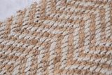 Hand-woven jute texture in alternating undyed light beige and natural brown braids.