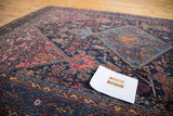 Vintage Distressed Malayer rug with stunning aqua blue medallion and blush rose patterns.