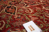 Vintage Ahar rug close-up showing scrolling palmette and floral motifs in rich jewel tones.