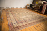 Antique Kermanshah carpet, angled view of allover Cyprus tree design and milfleur borders.