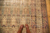 Antique Kermanshah carpet, intricate Cyprus tree and milfleur designs in cochineal red, navy, and ivory.