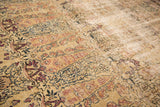 Kermanshah carpet detail: intricate milfleur and Cyprus tree pattern, time-softened red, blue, ivory tones.