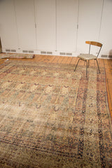 Corner of antique Persian Kermanshah carpet, milfleur borders, Cyprus tree motifs, ivory and red tones.