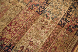 Antique Kermanshah rug, intricate cochineal red, navy, ivory milfleur pattern, worn texture.
