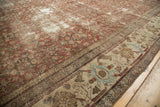 Distressed copper field Herati and light blue, sand border on antique Mahal carpet.