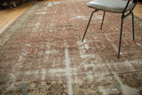 Hard distressed texture with faded copper Herati pattern on an antique Mahal carpet.