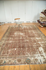 Corner of antique Mahal carpet, hard distressed, with worn fringe and faded blue border.