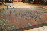 Antique Farahan fragment featuring a navy scrolling vine medallion and madder red floral field.