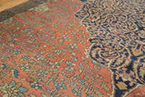 Antique Farahan carpet: madder red floral field, navy scrolling vine medallion, with low pile.