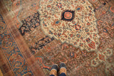 Antique Farahan carpet detail: unique jewel-toned palmettes and vines on an oxidized copper field.