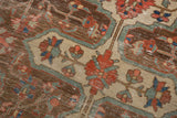 Antique Farahan rug's unique pale copper and bronze field with faded blue and blush florals.