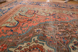 Antique Farahan carpet detail: decorative blush, blue, and pale bronze field motifs.