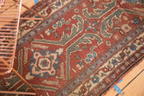 Asymmetric allover pattern of a vintage Turkish rug in dark copper, sky blue, and mallard green.