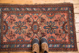 Vintage hand-knotted Lilihan rug, blush and indigo mina khani pattern, with feet for scale.