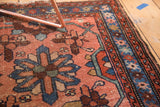 Hand-knotted pile of vintage Lilihan rug showing blush and indigo mina khani motifs and worn edge.