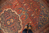 Scalloped navy medallion and brick red field with weeping willows on antique Bijar.
