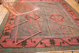 Vintage Kilim Carpet with geometric patterns in purple gray, teal, brick red, and pink.
