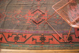 Finely woven vintage Kilim with geometric patterns in brick red, teal, and purple-gray.