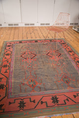 Finely woven vintage Kilim carpet with asymmetric geometric patterns in purple gray, brick red, and teal.